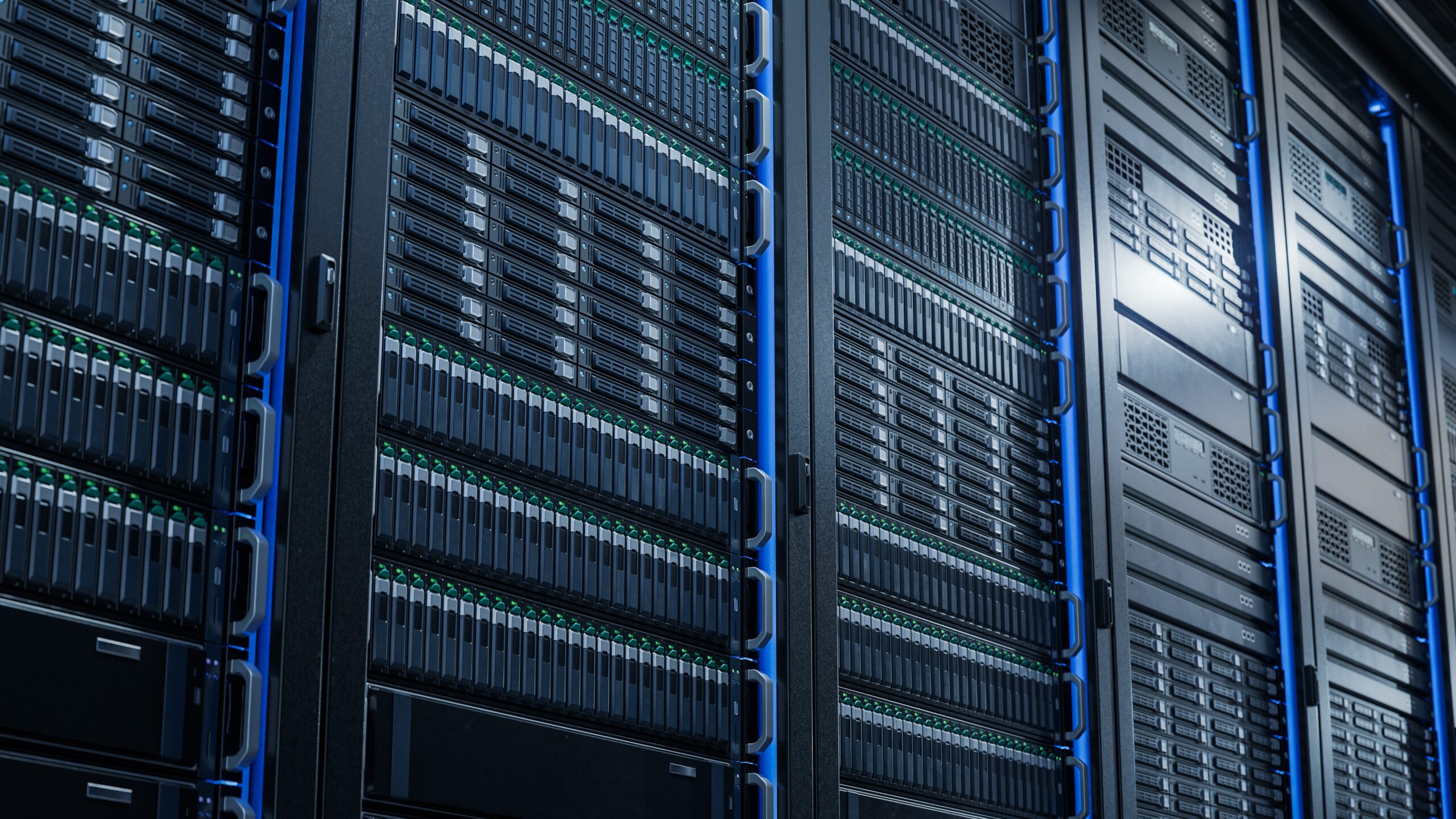 Data server racks filled with storage drives and hardware, highlighting advanced technology for data management and storage solutions.