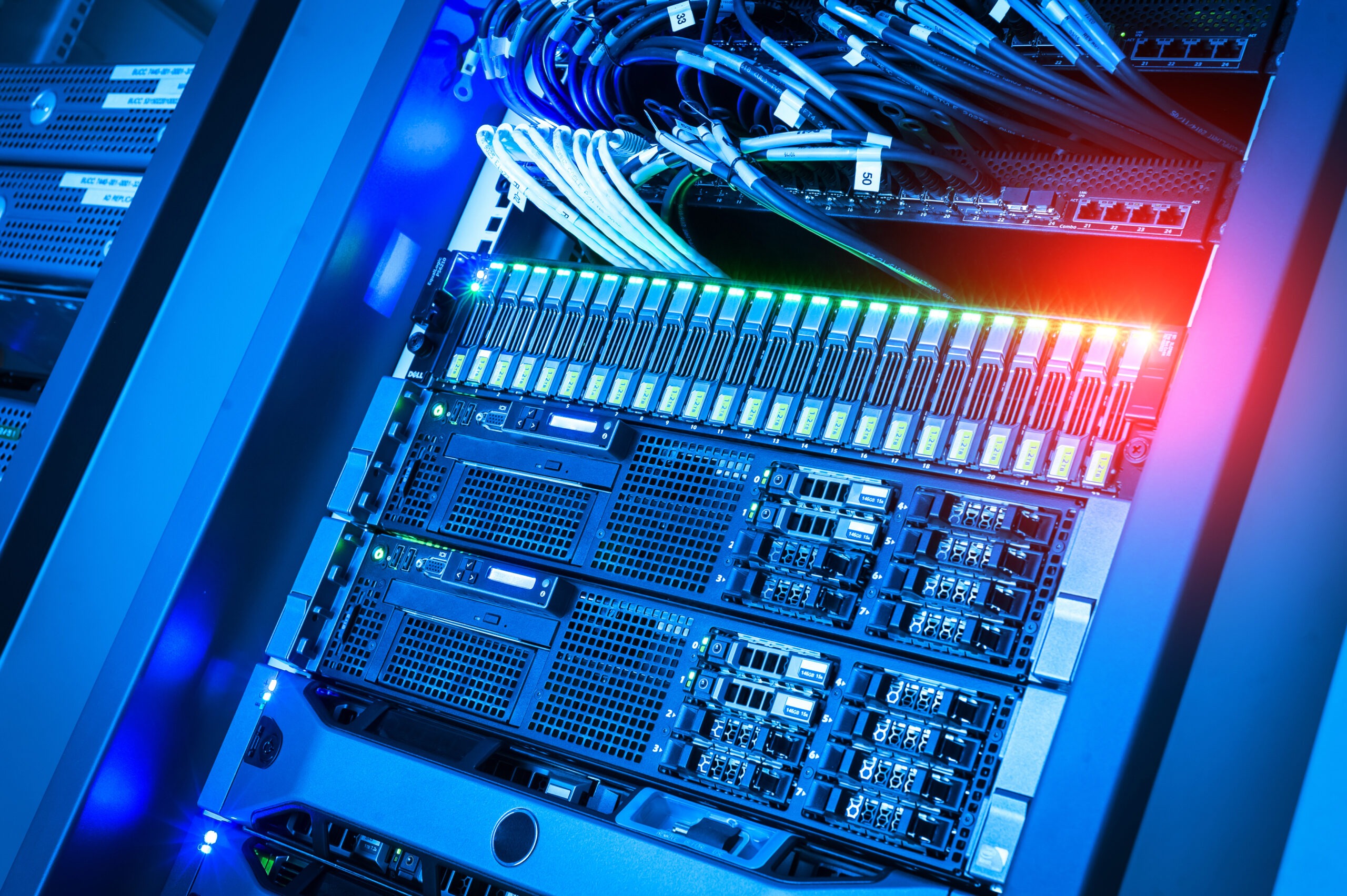 Data center server racks filled with high-performance hardware and illuminated connections, showcasing essential infrastructure for computing and storage.